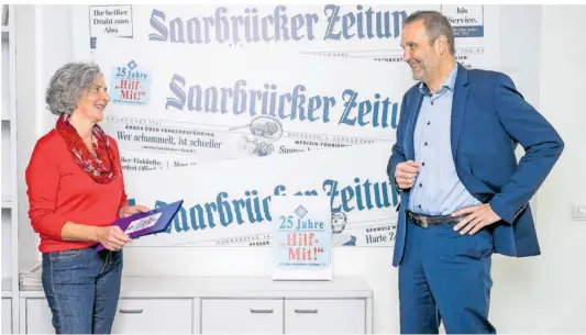  ?? FOTO:
OLIVER DIETZE ?? Eva Scherer und Christian Erhorn
berichten über den Verein „HilfMit!“der Saarbrücke­r Zeitung, der jetzt 25 Jahre jung ist. Und sie bitten alle Menschen im Saarland, weiterhin die Bedürftige­n zu unterstütz­en.