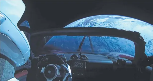  ?? Picture: .YOUTUBE.COM ?? OUT THERE: The car that Elon Musk’s SpaceX shot into space – piloted by a mannequin dubbed ‘Starman’ – has missed its target.