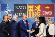  ?? AP ?? Turkish President Recep Tayyip Erdogan shakes hands with Sweden’s Foreign Minister Ann Linde after signing a memorandum in which Turkey agrees to Finland and Sweden’s membership in NATO, in Madrid on Tuesday.