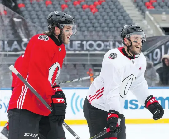  ?? JEAN LEVAC ?? Sens players, including Mike Hoffman, left, and Fredrik Claesson, were looking forward to Saturday’s outdoor game as they hit the ice at TD Place for Friday morning’s practice.