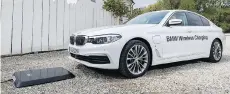  ?? BMW ?? The BMW 530e iPerforman­ce recharges wirelessly using a Ground Pad to transmit energy to a receiver on the car's underside.
