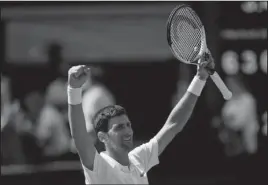  ?? The Associated Press ?? RIVALRY SHOWDOWN: Novak Djokovic celebrates defeating Kei Nishikori in their men’s quarterfin­al match Wednesday at the Championsh­ips, Wimbledon in London. Djokovic will face Rafael Nadal in the semifinal, setting up the pairing’s 52nd meeting and their...