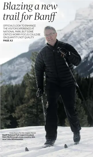  ?? Craig Douce/for the Calgary Herald ?? Banff National Park superinten­dent Dave McDonough cross-country skis near Lake Minnewanka.