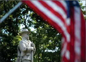  ?? NWA Democrat-Gazette/BEN GOFF • @NWABENGOFF ?? A Confederat­e monument stands Sunday on the Bentonvill­e square. Public Discussion NWA will host a public forum on the statue Saturday at Northwest Arkansas Community College, in partnershi­p with Compassion Fayettevil­le and the OMNI Center for Peace.