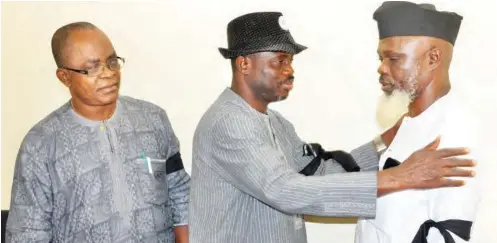  ?? PHOTO: ?? Executive members of the National Associatio­n of Nigeria Nurses and Midwives, led by their National President, Abdulrafiu Adeniji (middle); Deputy General Secretary, Barr. Ikenna Eze (left); and Secretary-General Oyo State branch, Akinfenwa Olabode, mourn the killing of two Red Cross aid nurses, Hauwa Liman and Saifura Hussaini by the ISWAP faction of Boko Haram and declare a three-day mourning period, in Abuja Abubakar Yakubu