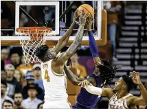  ?? NICK WAGNER / AMERICAN-STATESMAN ?? UT’s Mo Bamba stuffs a shot attempt by Kansas State guard Cartier Diarra, but the Longhorns overall were unimpressi­ve as they lost 67-64 at home Wednesday.