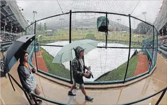  ?? GENE J. PUSKAR THE ASSOCIATED PRESS ?? Rain forced the rescheduli­ng of three Little League World Series games in South Williamspo­rt, Pa., on Tuesday.