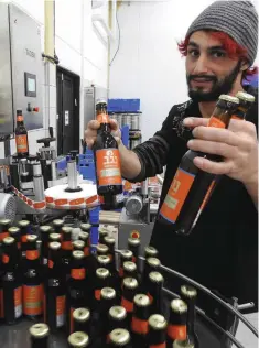  ??  ?? NEGEV BEER, which is also brewed at Malka, is bottled in a modern assembly line.