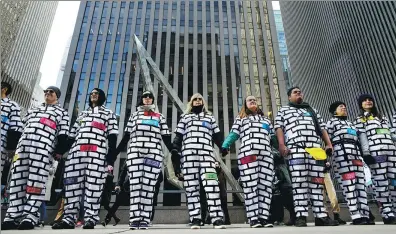  ?? EDUARDO MUNOZ / REUTERS ?? People dressed as a wall take part in the Women’s March in Manhattan in New York City on Saturday. Further marches were due to take place in cities across the world on Sunday.