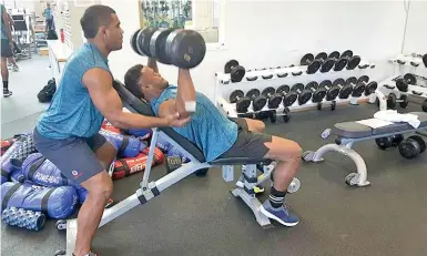  ?? Photo: FRU Media ?? Vodafone Fijian 7s halfback Vatemo Ravouvou assists Amenoni Nasilasila during their gym session at the Hong Kong Institute yesterday.