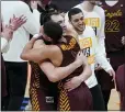  ?? PAUL SANCYA - AP ?? Loyola Chicago center Cameron Krutwig (25) and Loyola Chicago guard Lucas Williamson (1) celebrate after beating Illinois 71-58 after a men’s college basketball game in the second round of the NCAA tournament at Bankers Life Fieldhouse in Indianapol­is, Sunday.