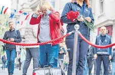  ?? ?? A pedestrian reacts grieving the victims of the explosion at the busy shopping street of Istiklal in Istanbul.