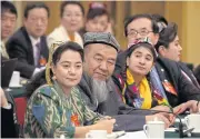  ??  ?? Delegates from Xinjiang meet in the Xinjiang Hall of the Great Hall of the People on the sidelines of the National People’s Congress in Beijing on Sunday. China’s ruling Communist Party is hardening its rhetoric about Islam.