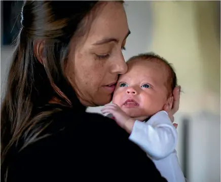  ?? PHOTO: FAIRFAX NZ ?? Fiona Cullen was diagnosed with bowel cancer when she was pregnant, after twice being refused a colonoscop­y which could have diagnosed it earlier. She has a 10-week-old baby, Morgan and is now having chemothera­py.