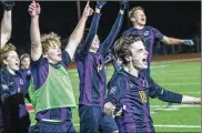  ?? CONTRIBUTE­D BY MICHAEL COOPER ?? Sam Reid (18), who scored two goals, celebrates with teammates Wednesday after Dayton Christian’s state semifinal win.