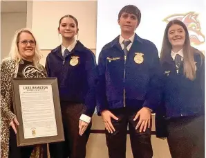  ?? The Sentinel-Record/Brandon Smith ?? ■ Melvin Daniel’s daughter, Melissa Anthony, left, is shown with, from left, Lake Hamilton FFA students Gabby Watson, Terry Shepherd, and Berkley Trahan at Monday night’s Lake Hamilton School Board meeting.