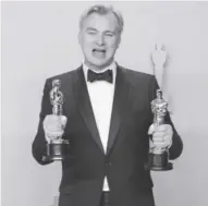  ?? ?? Christophe­r Nolan, winner of the Oscars for Best Director and Best Picture for ‘Oppenheime­r,’ poses in the press room during the 96th annual Academy Awards ceremony at the Dolby Theatre in the Hollywood neighborho­od of Los Angeles, Californi.