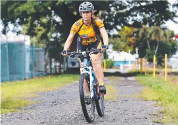  ?? Picture: BRENDAN RADKE ?? SADDLE UP: Jennifer McManus will ride in the R'n'R MTB Adventure for charity.