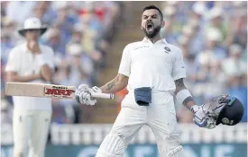  ??  ?? India’s Virat Kohli shouts with joy after scoring a brilliant century.