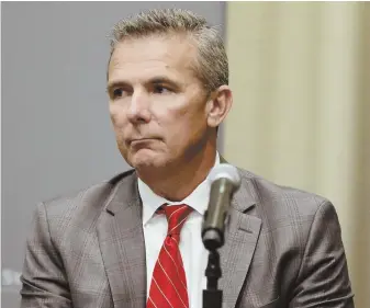  ?? AP FILE PHOTO ?? GRUESOME TIMES: Urban Meyer’s Ohio State team is scheduled to open its season without him on Saturday against Oregon State, but that seems almost beside the point given the scandal enveloping both the program and the school.