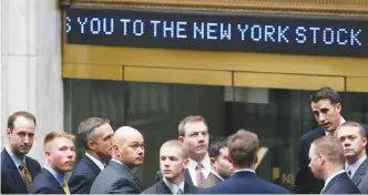  ??  ?? NEW YORK: Businessme­n arrive at the New York Stock Exchange in New York. It was on March 9, 2009, that stocks finally hit bottom in the financial crisis, after the Standard & Poor’s 500 index lost 55 percent in 17 months and gutted retirement and other...