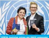  ?? — AFP ?? GENEVA: Australian actress and UNHCR ambassador Cate Blanchett (right) and formerly stateless refugee in Brazil Maha Mamo show their passports during a press conference yesterday.
