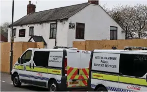  ??  ?? Raid: Police swoop on the boarded-up site in the village of Brinsley