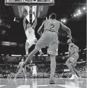  ?? [PHOTO BY BRYAN TERRY, THE OKLAHOMAN] ?? Josh Huestis, seen dunking on the Bulls in Oklahoma City on Nov. 15, averaged 2.3 points and 14.2 minutes per game in 2017-18 for the Thunder.