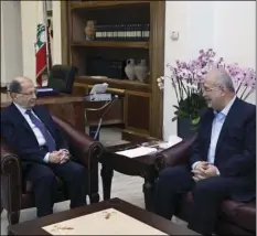  ??  ?? In this photo released by the Lebanese Government, Lebanese President Michel Aoun (left) meets with the head of Hezbollah’s parliament­ary bloc Mohammed Raad, at the Presidenti­al Palace in Baabda, east of Beirut, Lebanon on Monday. Aoun has begun...