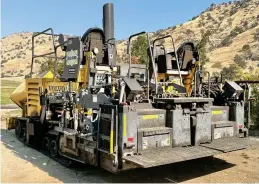  ?? RECORDER BY BRENT GILL ?? PHOTOS FOR THE
The paving machine parked at the end of my driveway, ready to spread the cold-mix asphalt on Globe Drive on Monday.