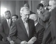  ?? The New York Times/GABRIELLA DEMCZUK ?? Senate Majority Leader Mitch McConnell leaves a news conference about tax policy Wednesday on Capitol Hill.