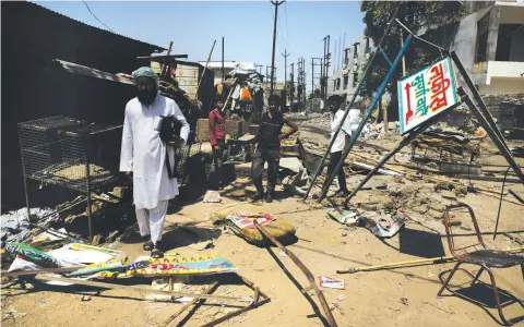  ??  ?? Just two days after the Uttar Pradesh government's order, local authoritie­s bulldozed all the 128 meat shops in Banda district