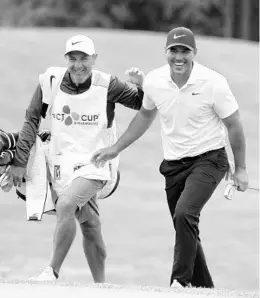  ?? PARK JI-HO/AP ?? Former FSU All-American Brooks Koepka, right, was thrilled to earn the coveted No. 1 spot in the Official World Golf Ranking.