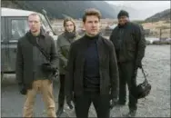  ?? DAVID JAMES — PARAMOUNT PICTURES AND SKYDANCE VIA ASSOCIATED PRESS ?? This image released by Paramount Pictures shows, from left, Simon Pegg, Rebecca Ferguson, Tom Cruise and Ving Rhames in a scene from “Mission: Impossible - Fallout.”