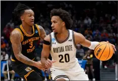  ?? DYLAN BUELL — GETTY IMAGES ?? Montana State’s Robert Ford III drives to the basket against Mikale Stevenson of Grambling State during the second half Wednesday at University of Dayton Arena in Dayton, Ohio.