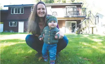  ?? MIKE BELL ?? Langley resident Danielle Harris, seen with her six-month-old daughter Alexandra, says health care and child care are important issues for her that will inform her vote in Saturday's election.