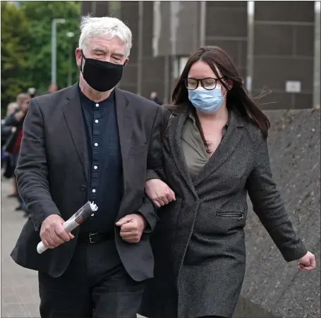  ?? ?? Natalie Mcgarry and her father Brian leave Glasgow Sheriff Court where she was found guilty of embezzling almost £25,000