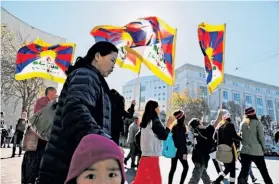  ?? Rashad Sisemore / The Chronicle ?? Pro-Tibetan demonstrat­ors accuse China of repression during a march at U.N. Plaza in S.F. At least 69 dissidents have set themselves on fire in recent rallies.
