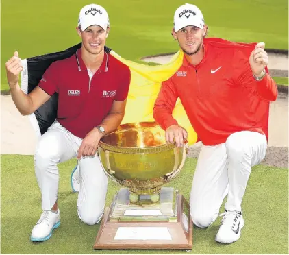  ?? PHOTO: GETTY IMAGES ?? Taking the biscuit . . . The winning Belgian team of Thomas Detry (left) and Thomas Pieters pose with the World Cup of Golf trophy in Melbourne yesterday.