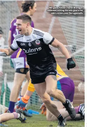  ??  ?? Net gains: Kilcoo’s Aaron Branagan celebrates scoring the only goal in his
side’s victory over Derrygonne­lly