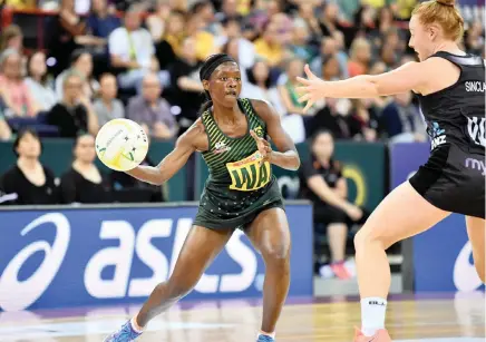  ?? EPA ?? CROWD FAVOURITE: Bongiwe Msomi of South Africa gets past Sam Sinclair of New Zealand during the Netball Quad Series in Brisbane last year.