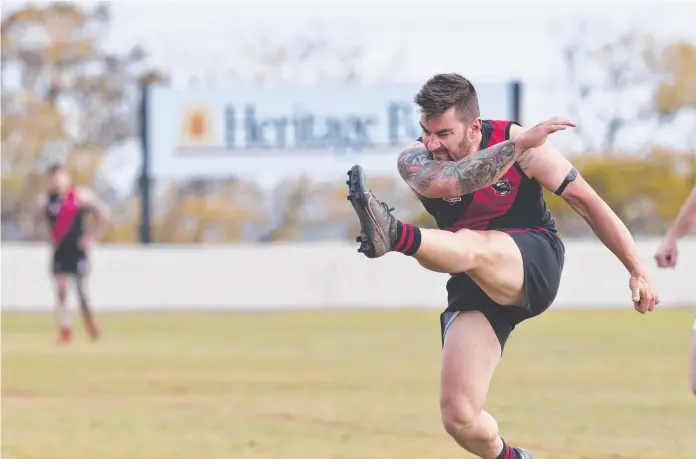  ?? Picture: Nev Madsen ?? SMOKED
IT: Kaine
Ellis gets a hold of one for South Toowoomba as the Bombers took top spot courtesy of a defeat of Coolaroo.