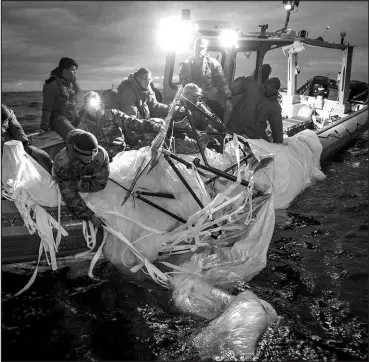  ?? U.S. NAVY VIA AP ?? Sailors assigned to Explosive Ordnance Disposal Group 2 recover a high-altitude surveillan­ce balloon Feb. 5 off the coast of Myrtle Beach, S.C.