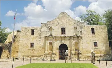  ?? Eric Gay Associated Press ?? A NEW BOOK debunks myths surroundin­g the Alamo, shown during an Air Force Thunderbir­ds f lyover on May 13, 2020. Texas Lt. Gov. Dan Patrick pressured a history museum to cancel a discussion about the book.