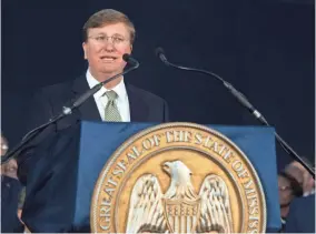  ?? SARAH WARNOCK/CLARION LEDGER VIA USA TODAY NETWORK ?? Mississipp­i Gov. Tate Reeves delivers his first State of the State Address on the steps of the Capitol in Jackson, Miss., on Monday.