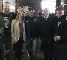  ?? TWITTER ?? UCP Edmonton-West Henday nomination candidate Nicole Williams poses with members of the Soldiers of Odin during a party pub night.