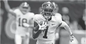  ?? JOHN BAZEMORE/AP ?? Alabama wide receiver Jameson Williams carries for a touchdown against Miami on Sept. 4 in Atlanta.