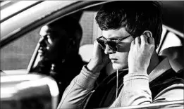  ?? WILSON WEBB/TRISTAR PICTURES ?? Jamie Foxx, left, plays a bank robber and Ansel Elgort plays Baby, the getaway driver.
