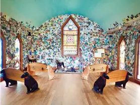  ?? Photos for The Washington Post by Melanie D.G. Kaplan ?? ■ Huneck’s Dog Chapel, which opened in 2000 at Dog Mountain, was designed as a sacred space where humans could sit, contemplat­e, grieve and celebrate their furry best friends.