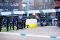  ?? MATT DUNHAM/ASSOCIATED PRESS ?? A police tent covers the spot where a Russian ex-spy and his daughter were found critically ill on Sunday. British police said a nerve agent was used in an attack on them.